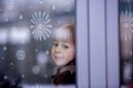 Little toddler boy, sitting behind the window Royalty Free Stock Photo