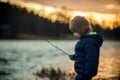 Little toddler child alone by the river Royalty Free Stock Photo