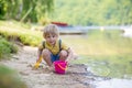 Little toddler child, cute boy, playing with toys in the sand on a lake Royalty Free Stock Photo