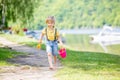 Little toddler child, cute boy, playing with toys in the sand on a lake Royalty Free Stock Photo