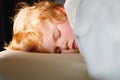 Little toddler child resting on say in parents bed. Adorable kid boy sleeping and dreaming. Peaceful and relaxed rest Royalty Free Stock Photo