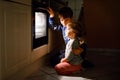 Little toddler girl and cute kid boy baking muffins and cookies in domestic kitchen. Two children, siblings, brother and Royalty Free Stock Photo