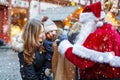 Little toddler girl with mother on Christmas market. Royalty Free Stock Photo