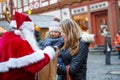 Little toddler girl with mother on Christmas market. Royalty Free Stock Photo