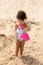 Little toddler girl playing at sandy beach, summer vacation and childhood concept Royalty Free Stock Photo