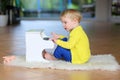 Little toddler girl plays toy piano Royalty Free Stock Photo