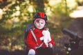 Little toddler girl with security helmet on head sitting in bike seat of her mother or father bicycle. Safe and child Royalty Free Stock Photo