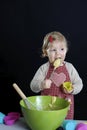 Little toddler making pastry,