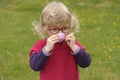 Little toddler playing tea time outdoors in the garden Royalty Free Stock Photo