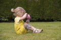 Little toddler playing tea time outdoors Royalty Free Stock Photo