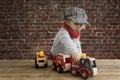 Little toddler playing with wooden cars Royalty Free Stock Photo