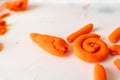 Little toddler plays play dough. Modeling orange sun. Creativity imagination