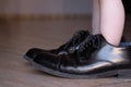 Little Toddler Stepping in Daddy`s Big Fancy Shoes Royalty Free Stock Photo