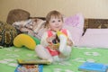 Little todler baby girl having fun indoor the room