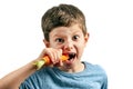 A little toothless boy was biting a carrot Royalty Free Stock Photo