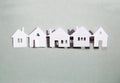 Little town houses in row. Property and house buying concept. Paper cut design background. Paper cut design background. Royalty Free Stock Photo