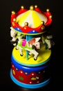 Little toy carousel horses merry go round