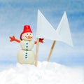 Little toy snowman with two white flags with place for text