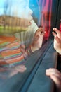 Little Traveler looking out of bus window Royalty Free Stock Photo