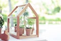 Little tree pot in bag with mini wood house for the wedding decoration. Royalty Free Stock Photo