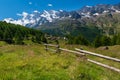 Little Triftalp village with the preserved old wooden farmhouses and majestic Mischabel massif and Dom peak behind Royalty Free Stock Photo