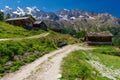 Little Triftalp village with the preserved old wooden farmhouses and majestic Mischabel massif and Dom peak behind Royalty Free Stock Photo