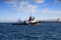 Little tug ship working in Algeciras bay. Royalty Free Stock Photo