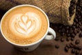 Little tulip latte art with coffe beans and sack Royalty Free Stock Photo