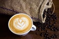 Little tulip latte art with coffe beans and sack Royalty Free Stock Photo