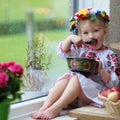 Little ukrainian girl in national dress with traditional food Royalty Free Stock Photo