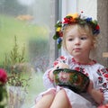 Little ukrainian girl in national dress with traditional food Royalty Free Stock Photo