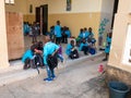 Little unidentified cute kids children are sitting on a bench in their primary school