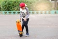 Little urban boy with a penny skateboard. Young kid riding in th Royalty Free Stock Photo