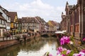 Little Venice in Colmar. Famous landmark, french street with colorful half-timbered houses, canal and bridge. Summertime, France. Royalty Free Stock Photo