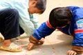 Little Vietnamese boys playing on the path