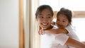 Little Vietnamese girl play with young mom at home Royalty Free Stock Photo
