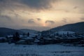 The snowy village Bolshoe ozero under sunset Royalty Free Stock Photo