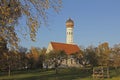 Little village chapel in apple orchard, autumn landscape