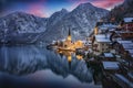 The little village of Hallstatt, Austria, during winter dusk time with snow