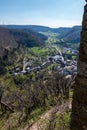 Little village in the middle of the german countryside with hills, forests, fields and meadows and the walls of a castle Royalty Free Stock Photo