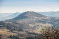 Little village in the middle of the german countryside with hills, forests, fields and meadows and the walls of a castle Royalty Free Stock Photo
