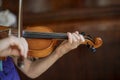 Little violinist lit by the sun is played out before the violin concert Royalty Free Stock Photo