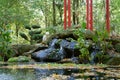 Little waterfall and pond in garden, purity, calm and harmony