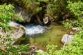 Little waterfall on a river in Retezat mountain in Campu lui Neag Romania Royalty Free Stock Photo