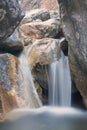 Little waterfall in rocks Royalty Free Stock Photo
