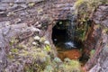 Little waterfall in sinkhole inside rock at mount Roraima