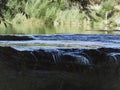 Little waterfalls with calm river Royalty Free Stock Photo