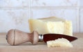 A little wedge of parmigiano cheese, with knife