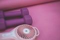Little Purple Weights and a Portable Fan Royalty Free Stock Photo