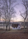 Little white cottage in colourful mysterious forest.